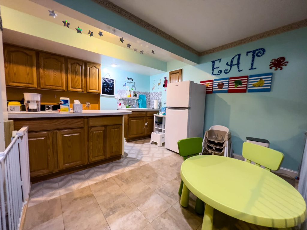 Kitchen and children's dining table where meals are prepared